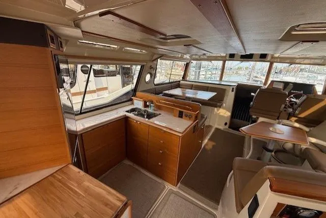 Slide: The Image of Interior of 2022 Ranger Tugs R-43 CB yacht with modern kitchen and seating area. - 6