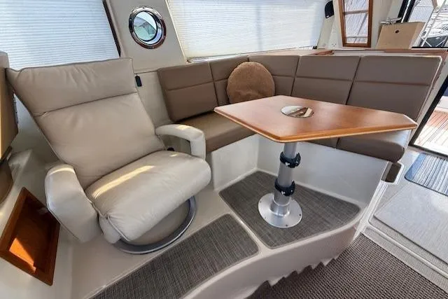 Slide: The Image of Luxurious interior of 2022 Ranger Tugs R-43 CB with plush seating and elegant table. - 9