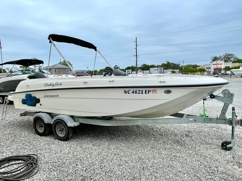 Slide: The Image of 2017 Bayliner E21 boat parked on trailer outdoors. - 10