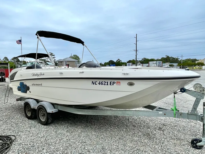 Slide: The Image of 2017 Bayliner E21 boat on trailer, side view. - 11
