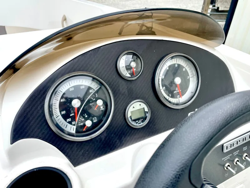 Slide: The Image of Dashboard of a 2017 Bayliner E21 boat with gauges. - 13