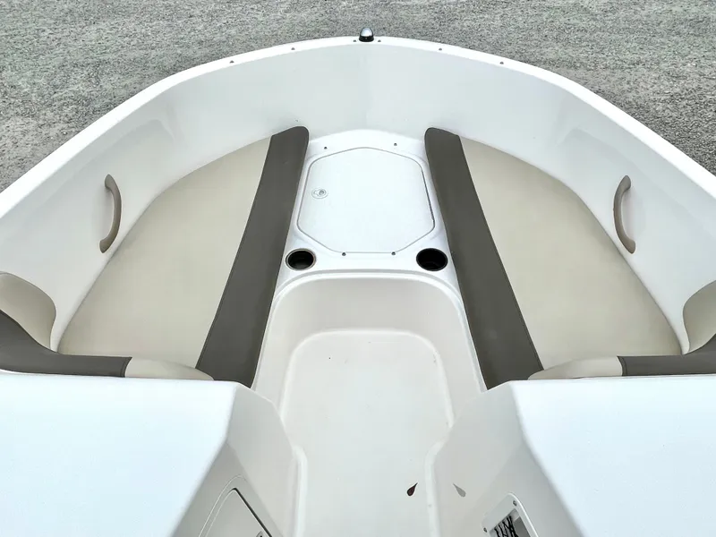 Slide: The Image of Interior view of a 2017 Bayliner E21 boat seating area. - 18