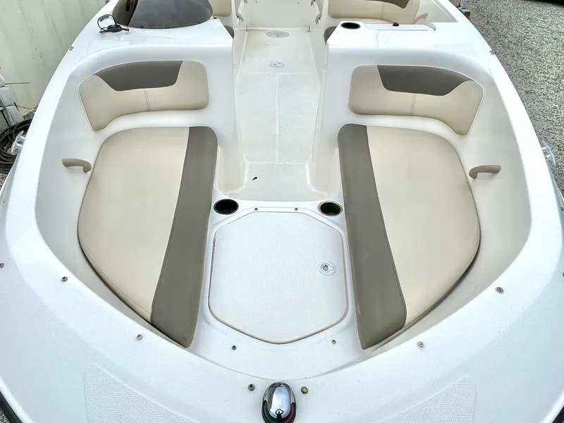 Slide: The Image of Interior of a 2017 Bayliner E21 boat with beige seating. - 22