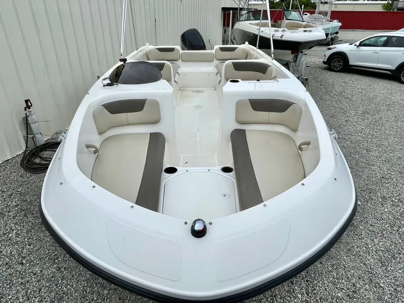 Slide: The Image of 2017 Bayliner E21 boat with spacious seating area. - 23