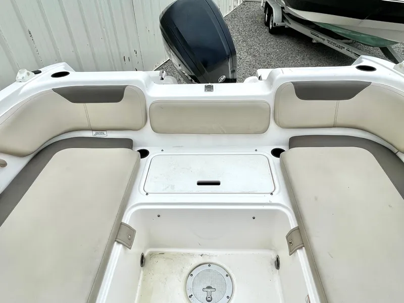 Slide: The Image of Interior of a 2017 Bayliner E21 boat with seating area. - 25