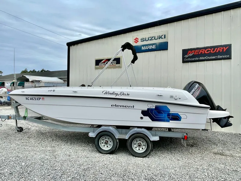 Slide: The Image of 2017 Bayliner E21 boat on trailer outside Suzuki Marine building. - 3