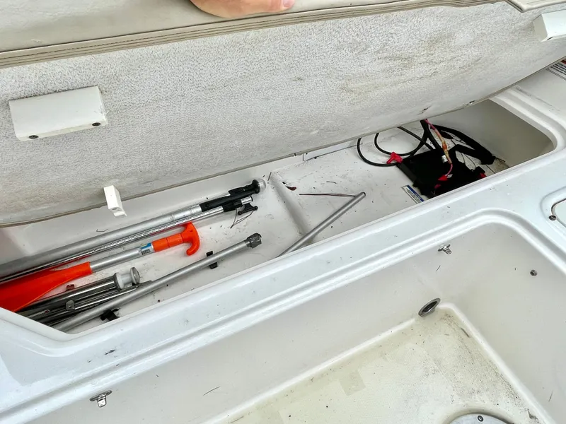 Slide: The Image of Storage compartment in Bayliner E21 boat with tools, 2017 model. - 31