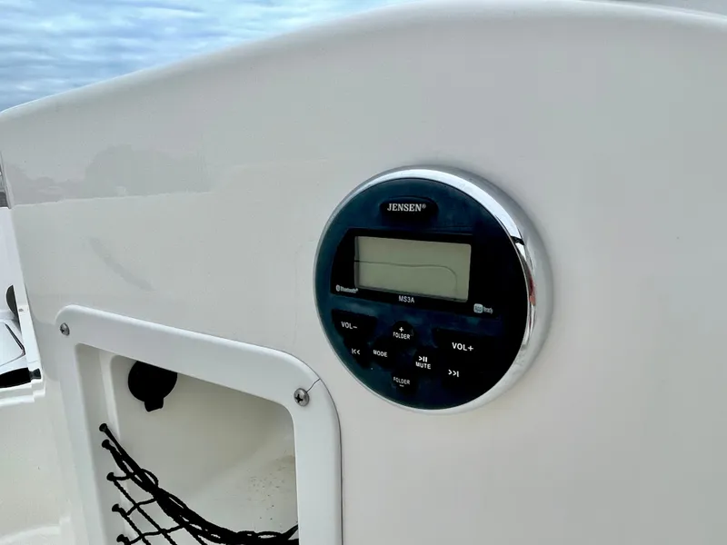 Slide: The Image of Jensen radio on 2017 Bayliner E21 boat dashboard. - 33