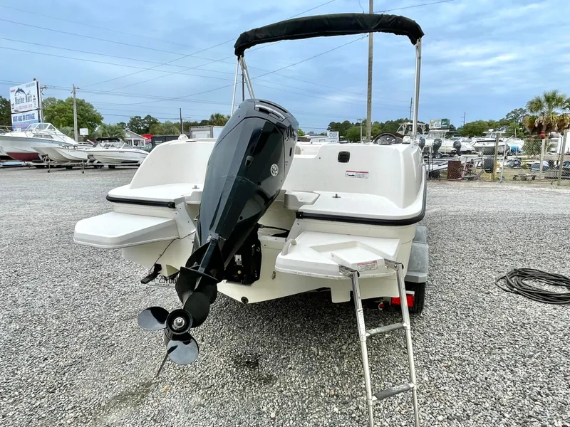 Slide: The Image of Rear view of a 2017 Bayliner E21 boat with outboard motor. - 6