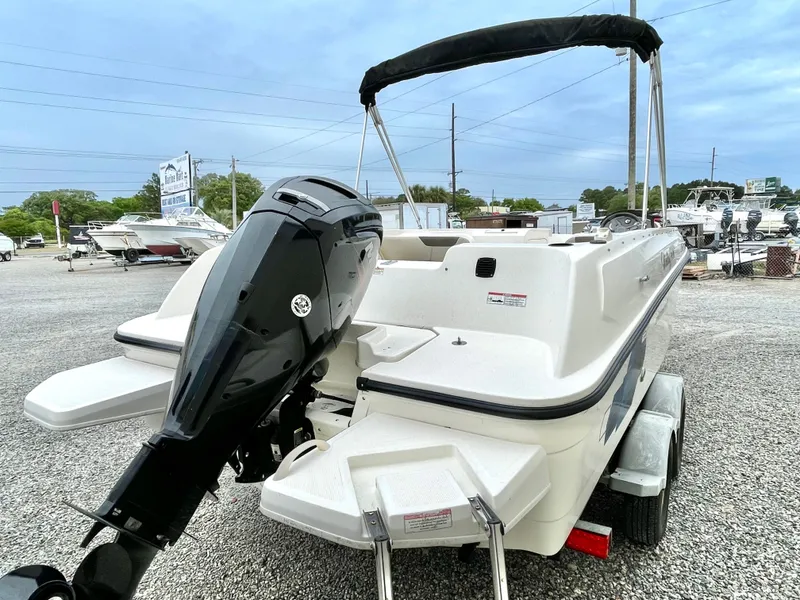 Slide: The Image of 2017 Bayliner E21 boat with outboard motor on trailer. - 7