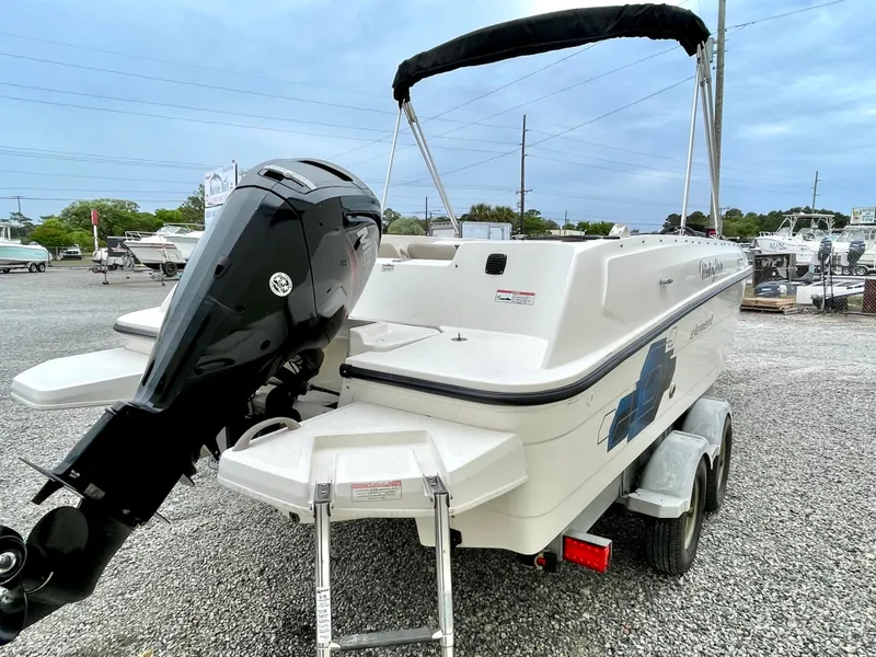 Slide: The Image of 2017 Bayliner E21 boat with outboard motor on trailer. - 8