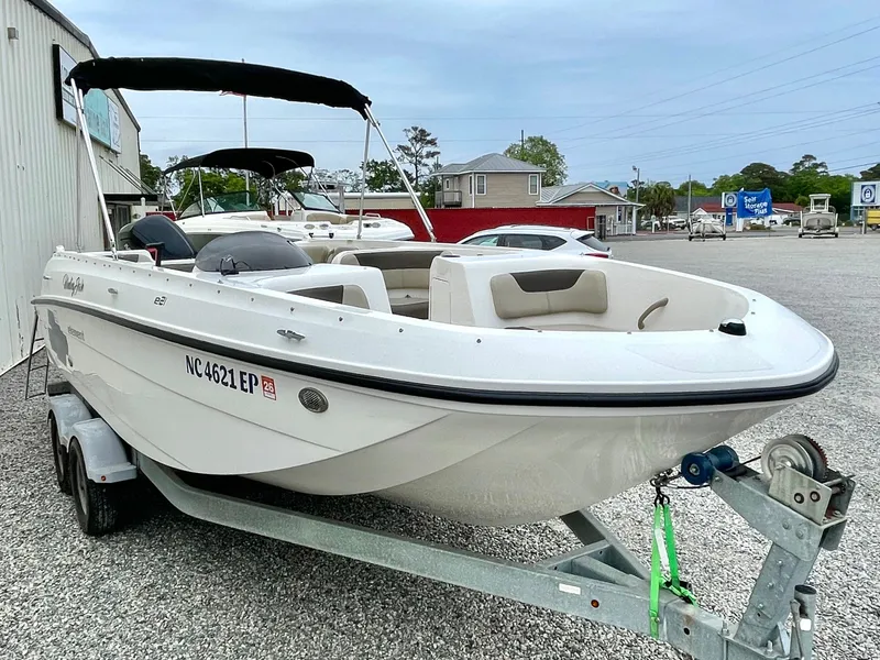 Slide: The Image of 2017 Bayliner E21 boat on trailer outdoors. - 9