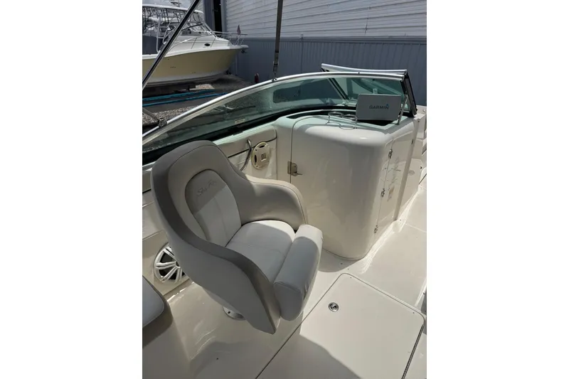 Slide: The Image of 2013 Sea Ray 280 Sundeck interior with captain's chair and Garmin navigation system. - 11