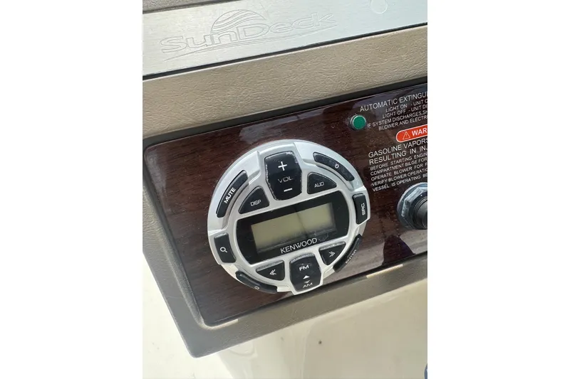 Slide: The Image of Control panel of a 2013 Sea Ray 280 Sundeck with Kenwood audio system. - 18