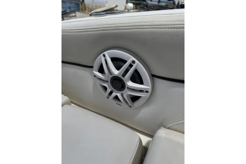 Slide: The Image of White speaker on 2013 Sea Ray 280 Sundeck boat's cushioned seating. - 19
