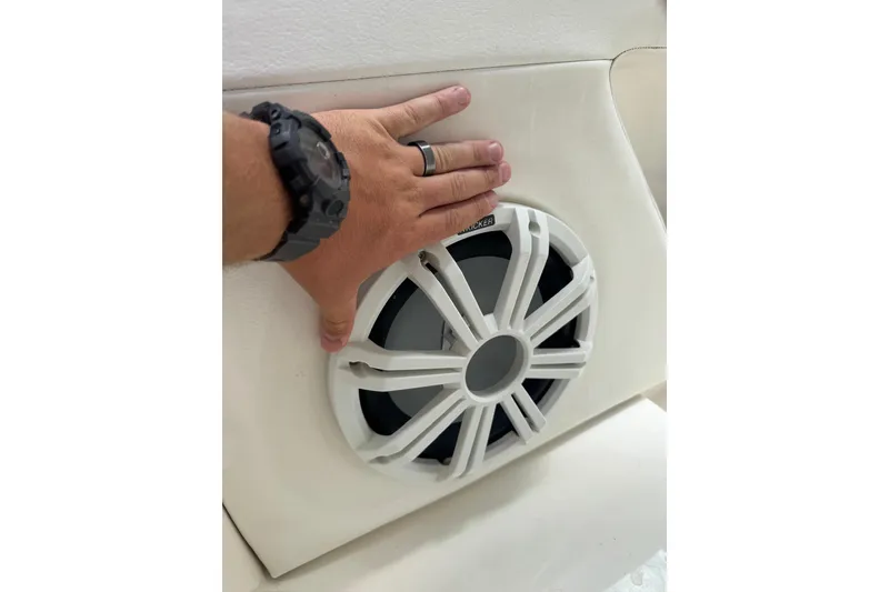 Slide: The Image of Hand touching speaker on 2013 Sea Ray 280 Sundeck boat interior. - 20