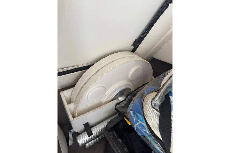 Slide: The Image of Storage compartment in 2013 Sea Ray 280 Sundeck boat with accessories and equipment. - 21