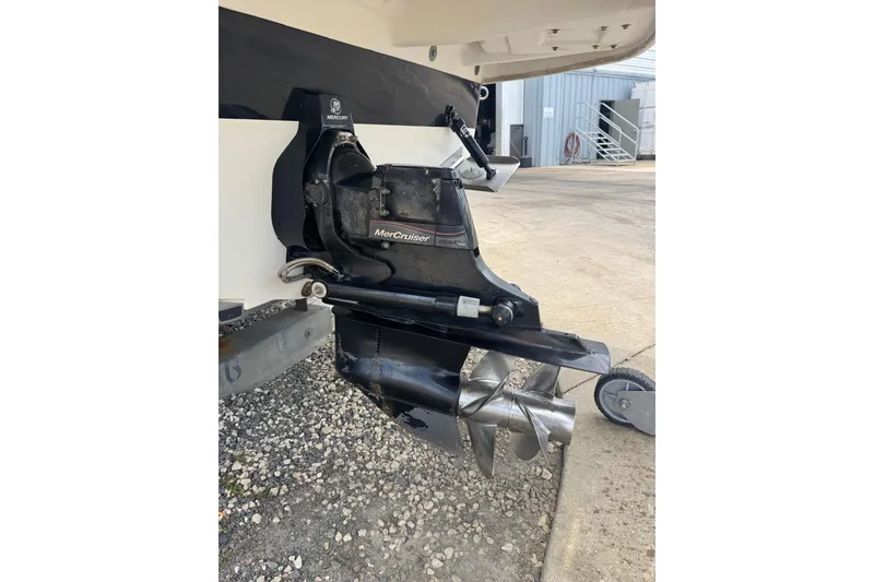 Slide: The Image of 2013 Sea Ray 280 Sundeck MerCruiser engine with stainless steel propeller. - 29