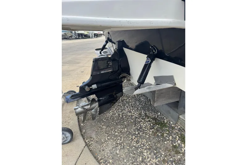 Slide: The Image of 2013 Sea Ray 280 Sundeck boat with MerCruiser outdrive, parked on gravel. - 31