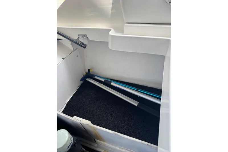 Slide: The Image of Storage compartment of 2013 Sea Ray 280 Sundeck boat with equipment inside. - 34