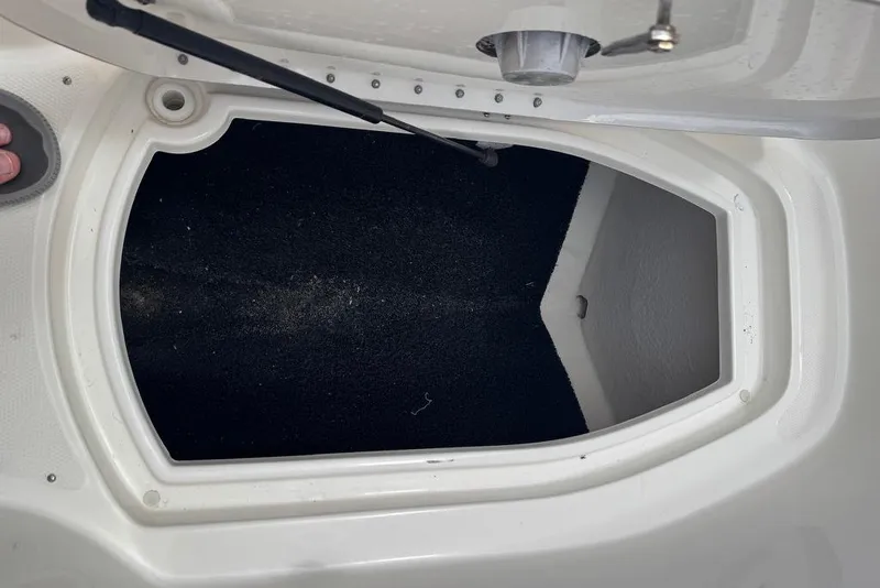 Slide: The Image of Open storage compartment on a 2013 Sea Ray 280 Sundeck boat. - 39