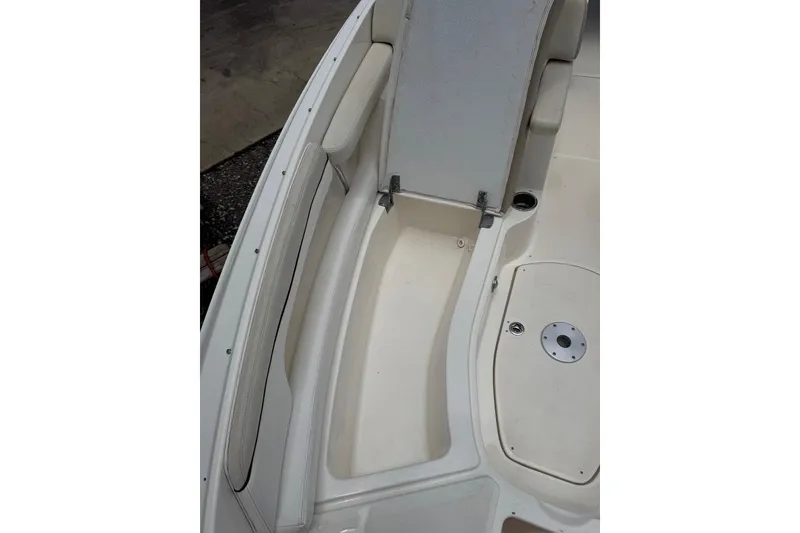 Slide: The Image of 2013 Sea Ray 280 Sundeck interior with seating and storage compartments. - 41