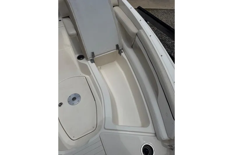 Slide: The Image of 2013 Sea Ray 280 Sundeck interior seating and storage area. - 42