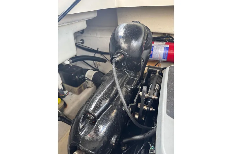 Slide: The Image of Engine compartment of a 2013 Sea Ray 280 Sundeck boat, featuring mechanical components. - 45