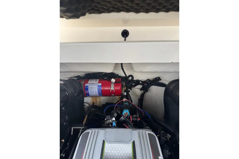 Slide: The Image of Engine compartment of a 2013 Sea Ray 280 Sundeck with visible fire extinguisher. - 46
