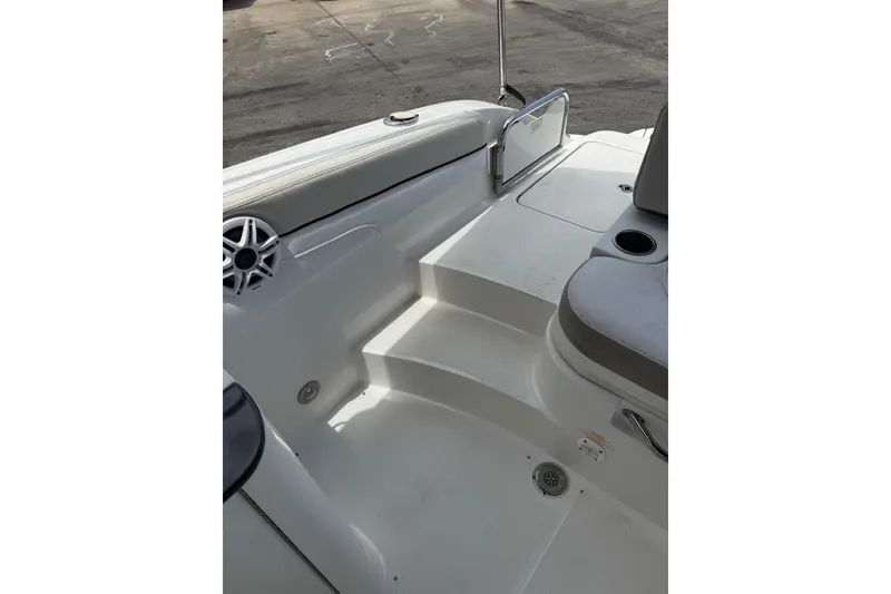 Slide: The Image of Interior view of 2013 Sea Ray 280 Sundeck boat, featuring seating and cup holders. - 9