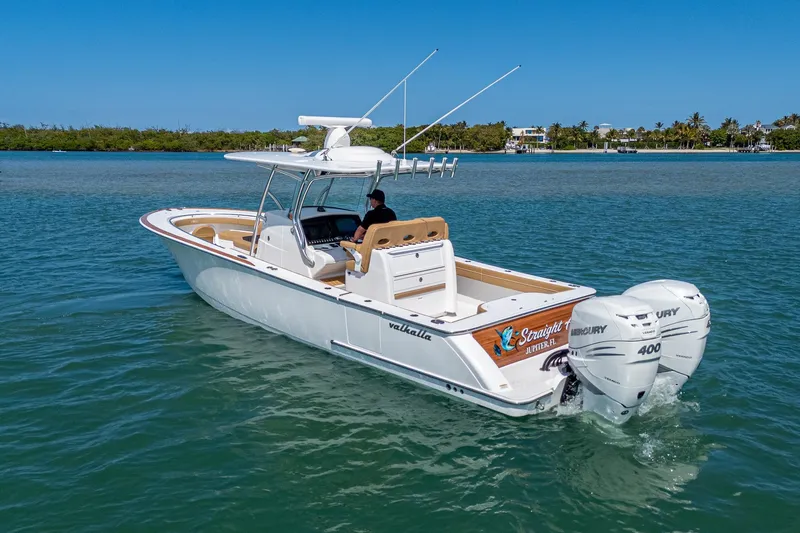 The Image of 2022 Valhalla Boatworks V-33 cruising on clear blue water. - 0