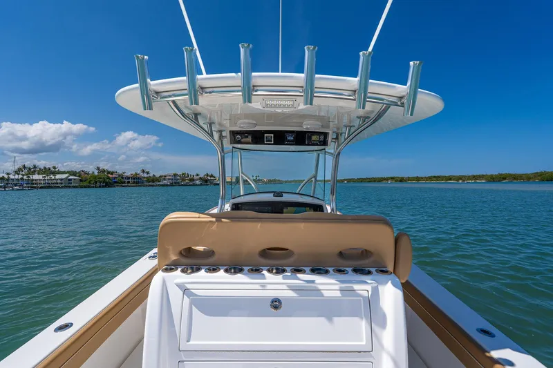 Slide: The Image of 2022 Valhalla Boatworks V-33 on calm waters under clear blue sky. - 10