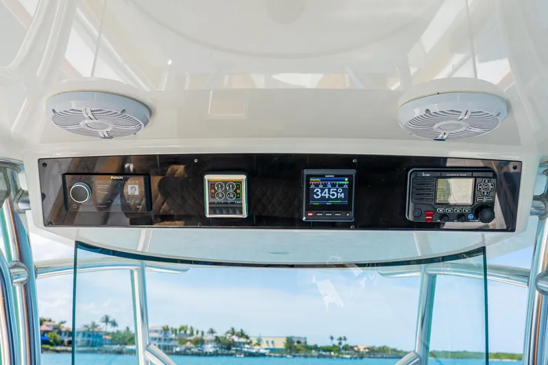 Slide: The Image of 2022 Valhalla Boatworks V-33 dashboard with navigation and communication equipment. - 13