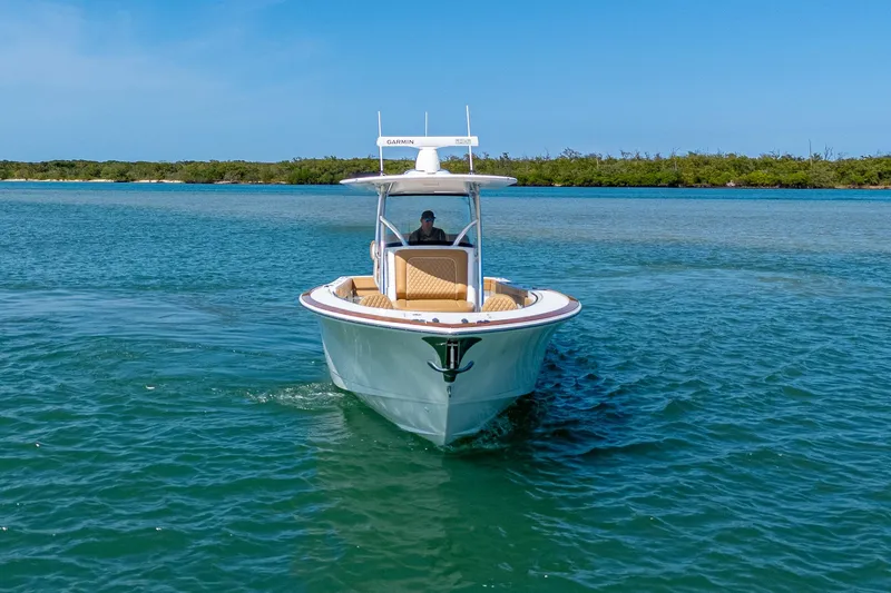 Slide: The Image of 2022 Valhalla Boatworks V-33 cruising on clear blue water. - 21
