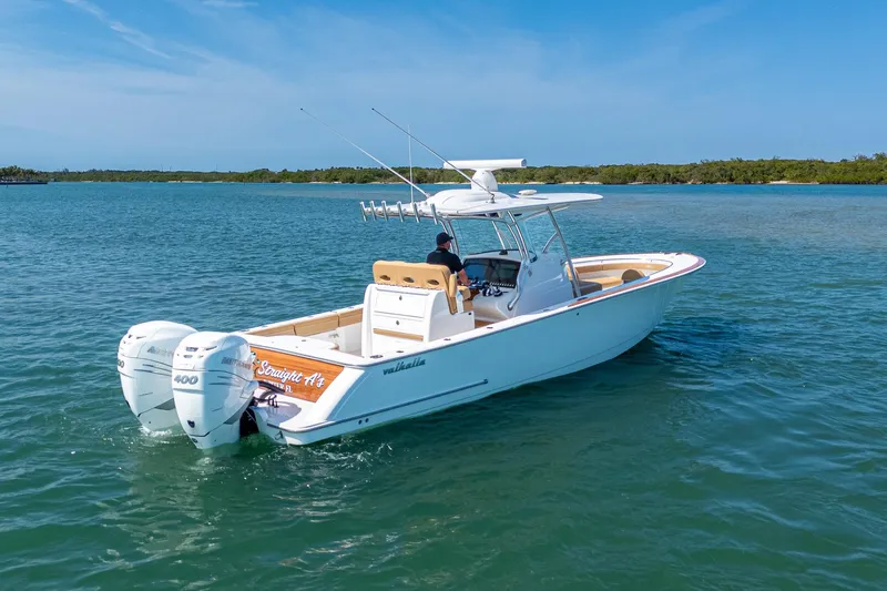 Slide: The Image of 2022 Valhalla Boatworks V-33 cruising on clear blue water under a sunny sky. - 23