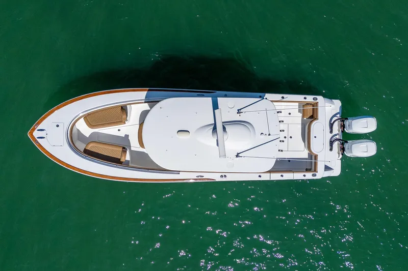 Slide: The Image of Overhead view of 2022 Valhalla Boatworks V-33 on clear green water. - 25