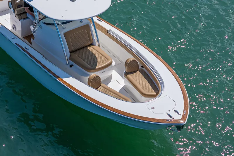 Slide: The Image of 2022 Valhalla Boatworks V-33 on sparkling water, featuring elegant seating and sleek design. - 27