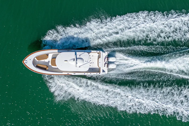 Slide: The Image of Aerial view of 2022 Valhalla Boatworks V-33 cruising on green water. - 29