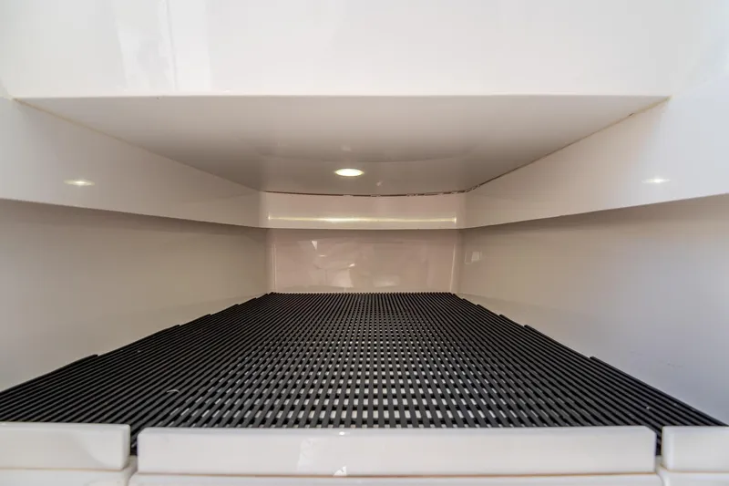 Slide: The Image of Interior storage compartment of 2022 Valhalla Boatworks V-33 with non-slip surface. - 35
