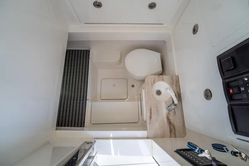 Slide: The Image of 2022 Valhalla Boatworks V-33 interior bathroom with toilet and sink. - 36