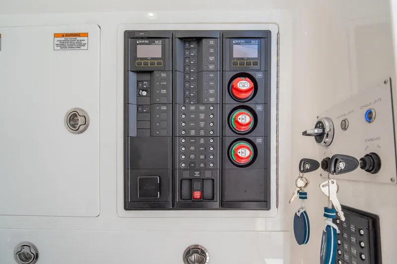 Slide: The Image of Control panel of 2022 Valhalla Boatworks V-33 with keys and switches visible. - 37