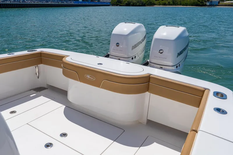 Slide: The Image of 2022 Valhalla Boatworks V-33 with twin Mercury engines on calm water. - 8