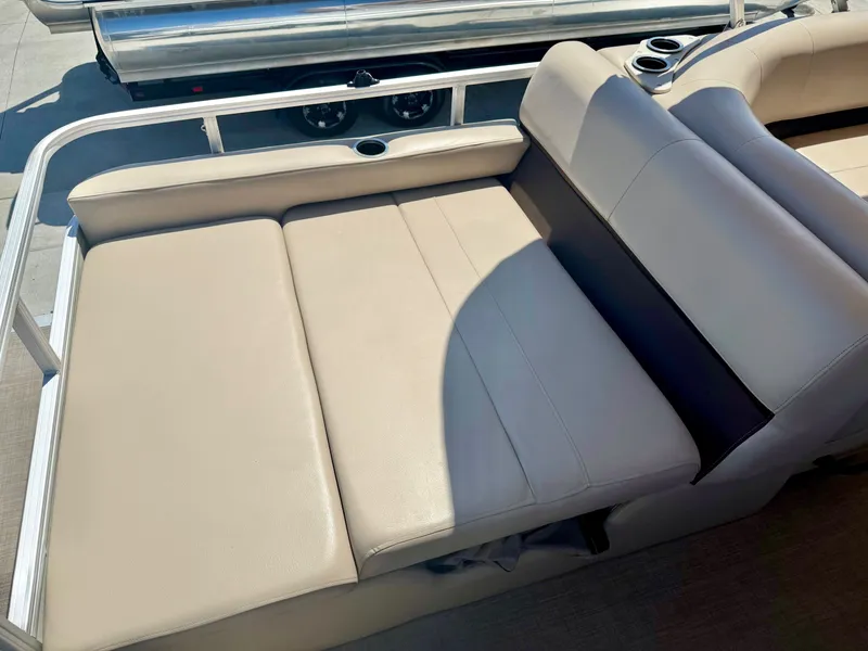 Slide: The Image of 2017 Sun Tracker Party Barge 24 DLX seating area, beige upholstery. - 8