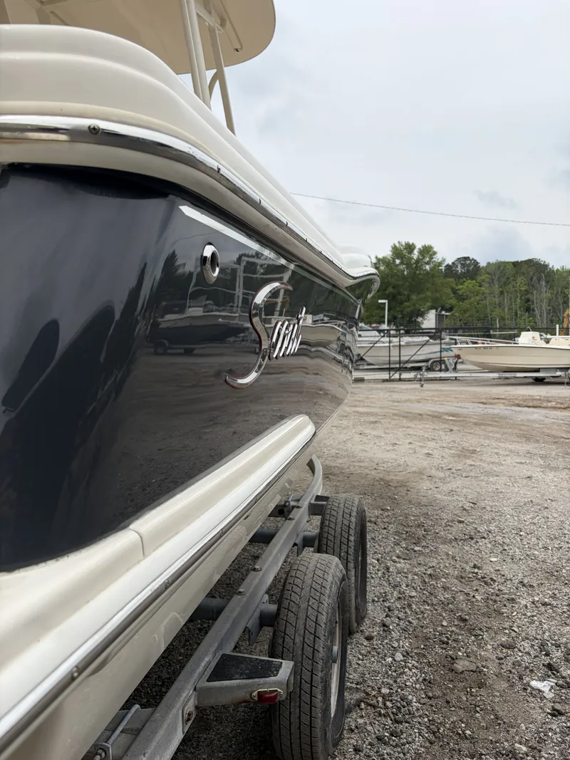 Slide: The Image of 2018 Scout 215 XSF boat on a trailer. - 7