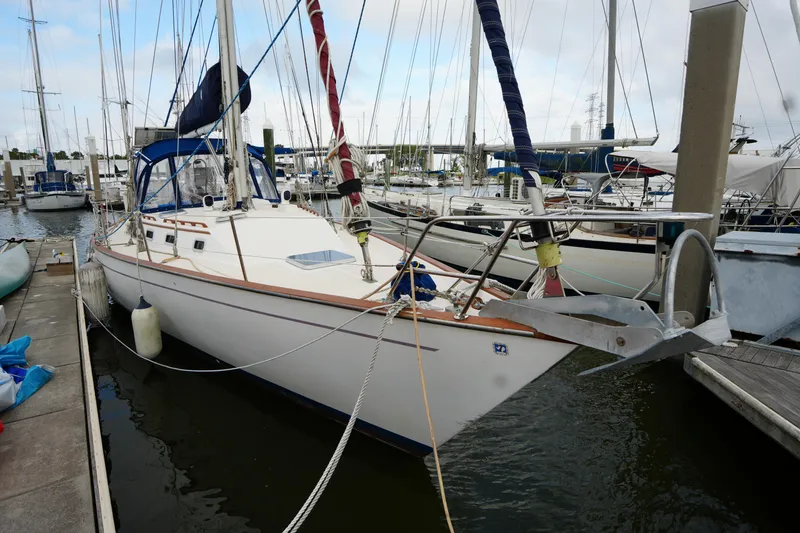 The Image of 1985 Morgan 43 sailboat docked at marina, featuring sleek design and nautical equipment. - 1