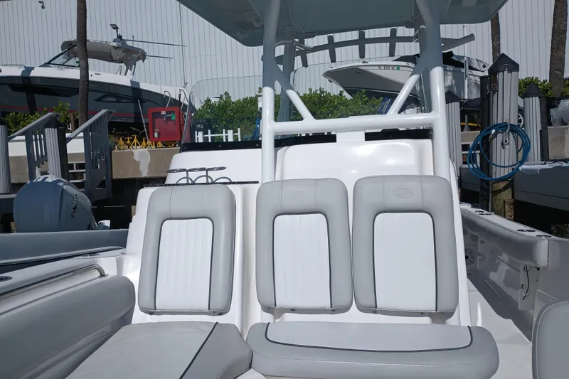 Slide: The Image of 2020 Sea Fox 249 Avenger boat interior with white seating and helm station. - 11