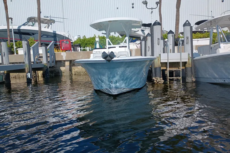 Slide: The Image of 2020 Sea Fox 249 Avenger boat docked in marina, front view. - 2