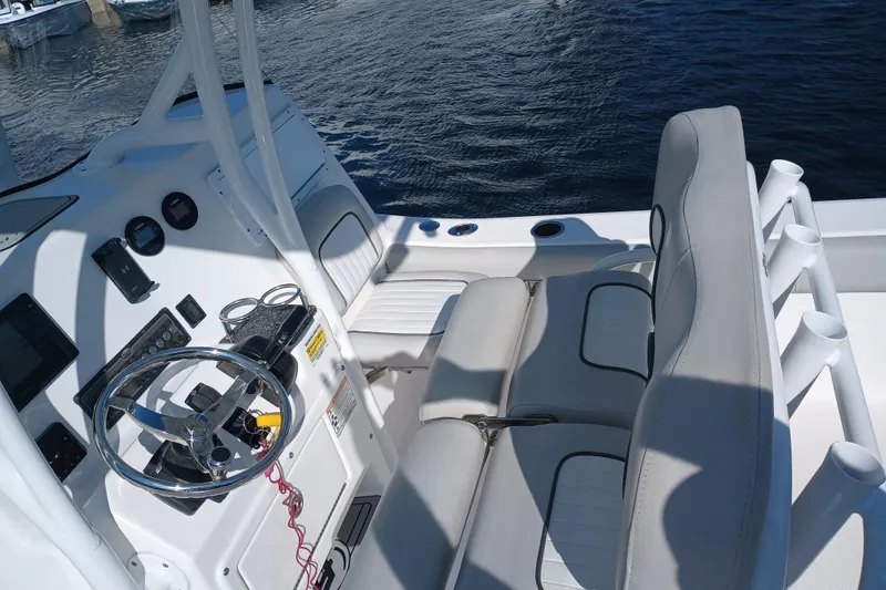 Slide: The Image of 2020 Sea Fox 249 Avenger boat interior with steering wheel and seating. - 24
