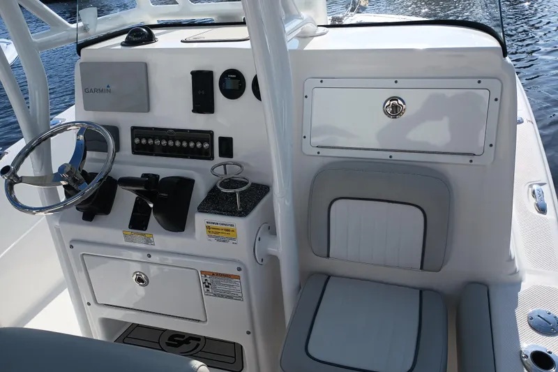 Slide: The Image of 2020 Sea Fox 249 Avenger boat console with steering wheel and control panel. - 31