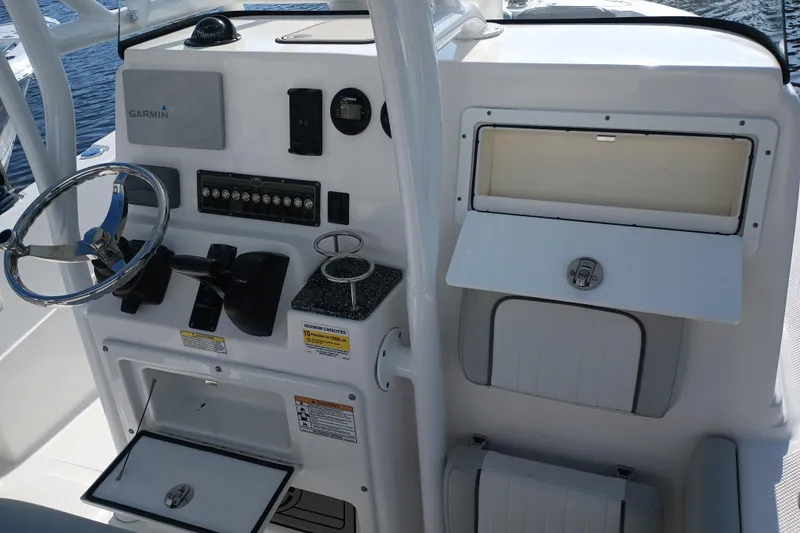 Slide: The Image of 2020 Sea Fox 249 Avenger boat console with steering wheel and Garmin navigation system. - 32